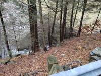 A view of the railroad culvert carrying Hop Brook under the former trestle