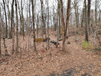 The trailhead of the Larkin State Park Trail on Route 63. The hike up to the railroad grade is obvious, reflecting the size of the former trestle here