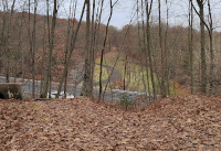 Standing on the western side of the former trestle over Route 63 and Hop Brook, looking towards the eastern side