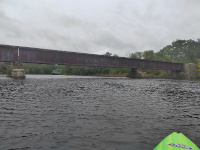 Facing north at the trestle. Butts Bridge is visible in the distance