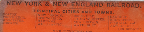 Part of a door check from the Boston Bijou Theatre, with an ad for the NY&NE Railroad