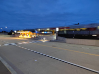 Looking at the northbound platform at Kane St in the last dwindling light on New Year's Eve, 2023. A Hartford Line train pulling CDOT Mafersa Coaches is visible