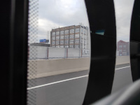 The Hartford Rubber Works building from a passing CTfastrak bus