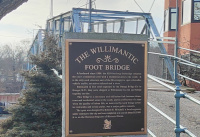A close up of the plaque explaining the bridge's history
